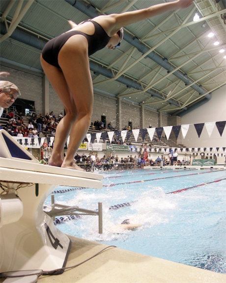 Mercer Islander Jennifer Pak starts to jump off the block as Christina Williamson