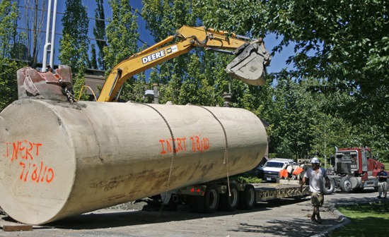 A crew of operators remove one of two 12