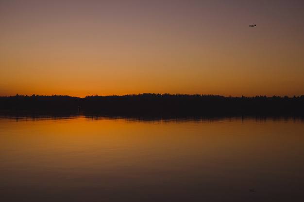 Sunset over Lake Washington in this view from Proctor Landing on Mercer Island on Friday