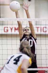 Islanders Sabrina Rasmussen blocks a ball during SeaKing district tournament play against Lakeside at Sammamish High School in Bellevue