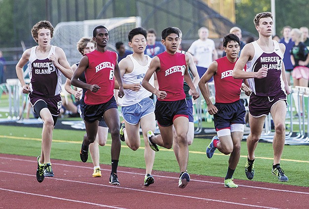 Mercer Island’s Eric Schulz (right) finished the boys 800 meter race in second place