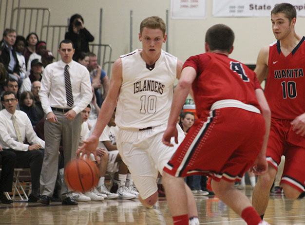Mercer Island’s Jake Stenberg drives to the hoop against Juanita Friday