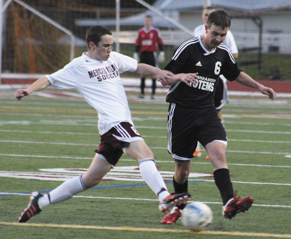 Mercer Island's Nate Umlauf (6) battles Sammamish's Tommy Danielsen (6) for the ball during the Islanders home win over the Totems on Tuesday