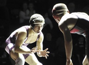 Mercer Island's Luke Wilson looks for a way to take down Ryley Absher of Mount Si during the Islanders Jan. 17 home match. Wilson lost by 9-8 decision.