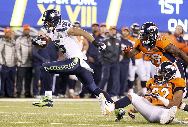 Seattle Seahawks receiver Jermaine Kearse breaks through Denver Bronco defenders for a 23-yard touchdown during the third quarter of Super Bowl XLVIII Sunday at MetLife Stadium in East Rutherford