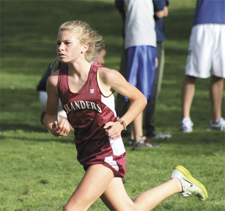 MIHS freshman Alida Scalzo heads to the finish line during last week’s meet in Bellevue. She finished in first place overall.