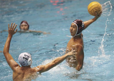MIHS senior Eugene Chong shoots over a Curtis High School defender during the Islanders’ 16-5 win.