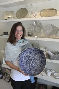 Terra Bella owner Nancy Meade shows off some of the shop’s unique pieces. The store opened in mid-July.
