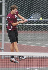 Jordan Smith returns a ball during the KingCo semifinals last week. He won the single tournament.