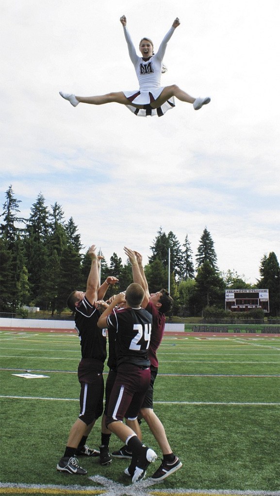 Three members of the MIHS football team joined the cheer squad this year