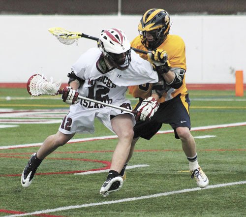Mercer Island Hayden Reisman elbows past a Bellevue player during the Islanders state semifinal loss to the Wolverines Wendesday.