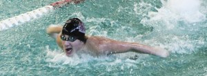 Nick Swaya swims the 100-yard butterfly event during the Mercer Island meet against Bellevue on Thursday