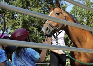 One of the students from Country Village Day School reacts after petting Harley