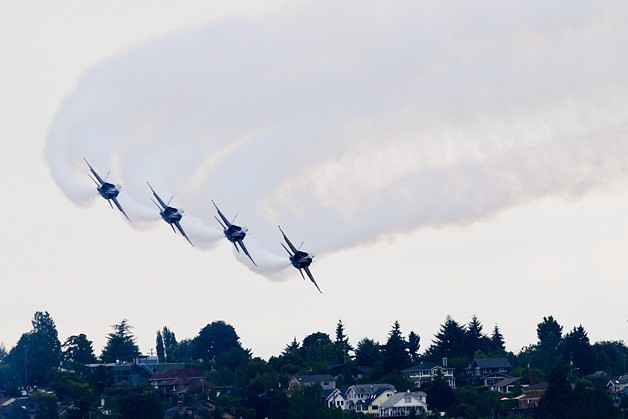 The U.S. Navy Blue Angels practice a modified 'flat' routine due cloud cover over Lake Washington on Friday.