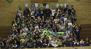 The students of St. Monica School show their Seahawk 12th Man spirit.