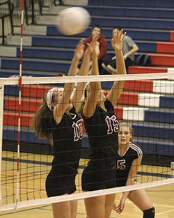 Mercer Island’s Natalie Robinson (10) and Olivia Hughes (15) go up for a block against Mount Si High School on Nov. 2. The Islanders lost 3-2.