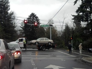 A vehicle is towed from the intersection of 86th Avenue and S.E. 40th Street after a collision on Friday