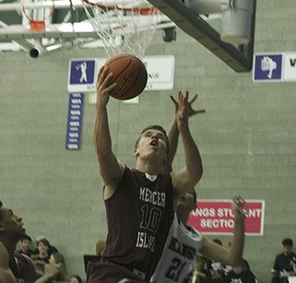 Emerson Schulz goes up for the reverse layup during MI’s 73-43 win Friday