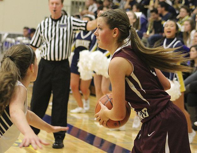 Mercer Island's Jamie Mounger looks to pass against Bellevue Friday