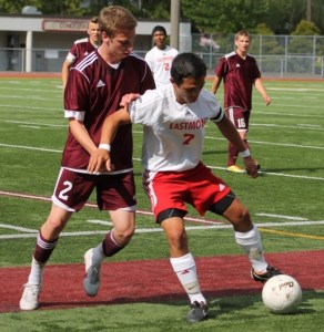 Jake Michael tries to get the ball away from Eastmont during the Islanders state semifinal game on Friday afternoon. Mercer Island won 3-1 to advance to Saturday's state finals.