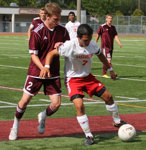 Jake Michael tries to get the ball away from Eastmont during the Islanders state semifinal game on Friday afternoon. Mercer Island won 3-1 to advance to Saturday's state finals.