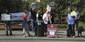 A group gathered Wednesday at noon near Congressman Dave Reichert's office on Mercer Island. The group