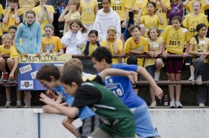 The fifth-grade boys break from the starting line of the 50-meter dash during the annual All-Island Track Meet at Islander Stadium on Mercer Island on Friday