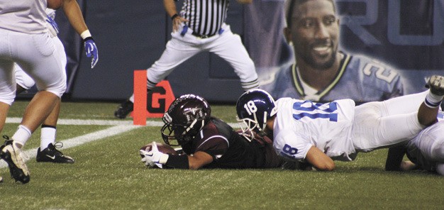 A Mercer Island player goes down with the football just short of the goal line during the Islanders overtime loss to Seattle Prep last Saturday at Century Link Field.