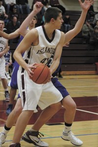 Mercer Island junior Joe Rasmussen looks for an open pass during the Islanders home win over Liberty on Monday
