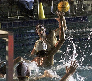 Mercer Island's Conner Vacca looks for his shot against Bellevue Tuesday night at Mercer Island Country Club. Bellevue beat Mercer Island