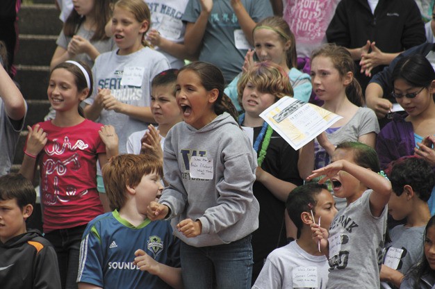 Andie Pillsbury cheers for her West Mercer classmates during the All Island track meet on Friday