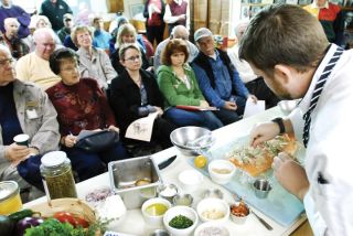 Chad Coleman/Mercer Island Reporter Executive chef Jeremy McLachlan of Salty’s on Alki Beach prepares some seafood dishes for the Lake Washington Chapter of Puget Sound Anglers
