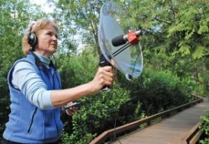 Chad Coleman/Mercer Island Reporter Island resident Chris Peterson records bird sounds along the boardwalk at Ellis Pond.
