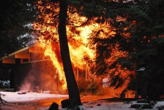 Chad Coleman/Mercer Island Reporter Firefighters from Mercer Island and Bellevue responded to reports of a “fully involved” fire at an unoccupied home under renovation adjacent to Groveland Beach Park at 3 p.m.