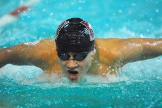 Islanders Murray Longbotham pushes for the finish in the 100-yard Butterfly event versus Issaquah at Mary Wayte Pool on Mercer Islandl ast Tuesday.