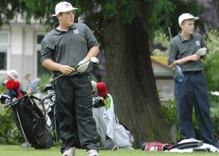 Islanders Murray Longbotham pushes for the finish in the 100-yard Butterfly event versus Issaquah at Mary Wayte Pool on Mercer Islandl ast Tuesday.