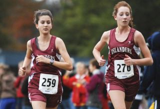 Chad Coleman/Mercer Island Reporter Islanders Gabbi Goyette and Phoebe Merritt compete at Lake Sammamish State Park.