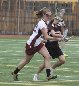 Mercer Island's Taylor Dahlgren tries to stay clear of a Holy Names players during the Islanders first playoff game of the season