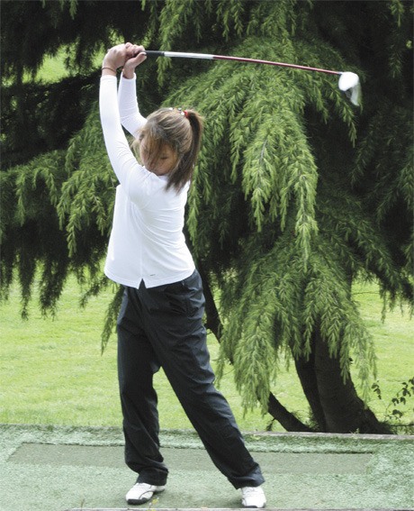 Kayce Ogishima swings at the first tee at Wayne Golf Course on Wednesday afternoon. The Mercer Island girls earned their third straight KingCo title after beating Inglemoor on Monday afternoon.