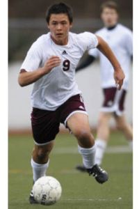 Islander Matt Johnson brings the ball up field for the unbeaten boys soccer team.