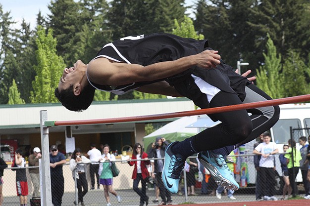 Cole Northrup goes up in the high jump during the 3A KingCo track and field championships Friday