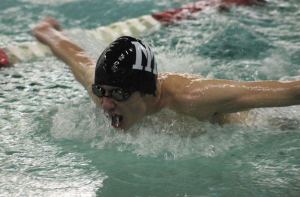 Mercer Island senior Harrison Leeds swims the 100 butterfly during the Islanders home meet against 4A Newport on Thursday