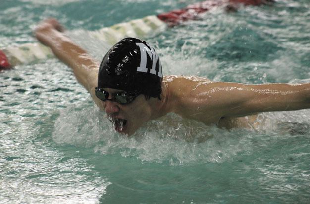 Mercer Island senior Harrison Leeds swims the 100 butterfly during the Islanders home meet against 4A Newport on Thursday