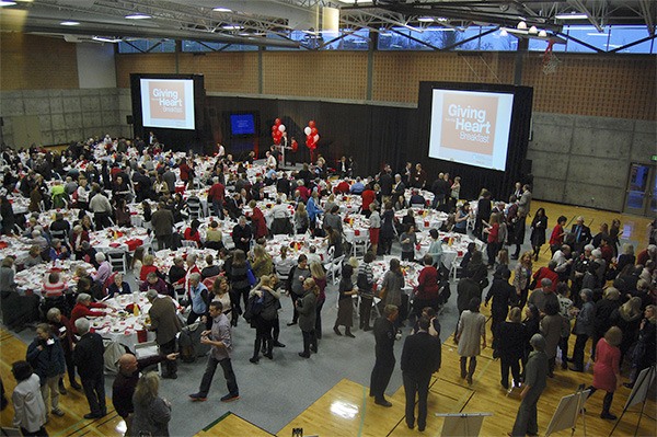 Giving from the Heart attendees chat and have coffee before the breakfast program begins at 7:30 a.m.