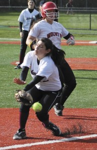 Mercer Island's Sofia Murillo missed a pass at third base as Mount Si's Mickey Blad runs up behind her. Mount Si beat the Islanders 15-1 last Thursday.