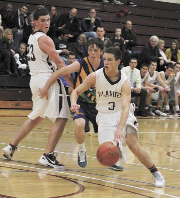 Mercer Island's Justen Altaras (3) runs around a Mornington Breaker player as Espen Platou (23) creates a screen. The Islanders beat the team from Australia on Thursday