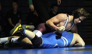 Mercer Island's Donnie Howard grapples with opponent Brendan Nguyen of Liberty in their 195 match Thursday
