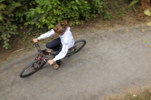 A youth rides a bike through Pioneer Park on the south end of Mercer Island.