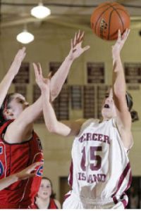 Islander Hailey Gullstad scores two of her six points during the fourth quarter against Juanita.