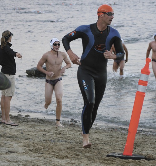 Participants in the Islander Aquathon head around the cone to start the second leg of the swimming portion of the race at Luther Burbank Park.